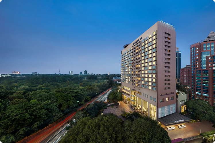 JW Marriott Bengaluru hotel exterior at dusk